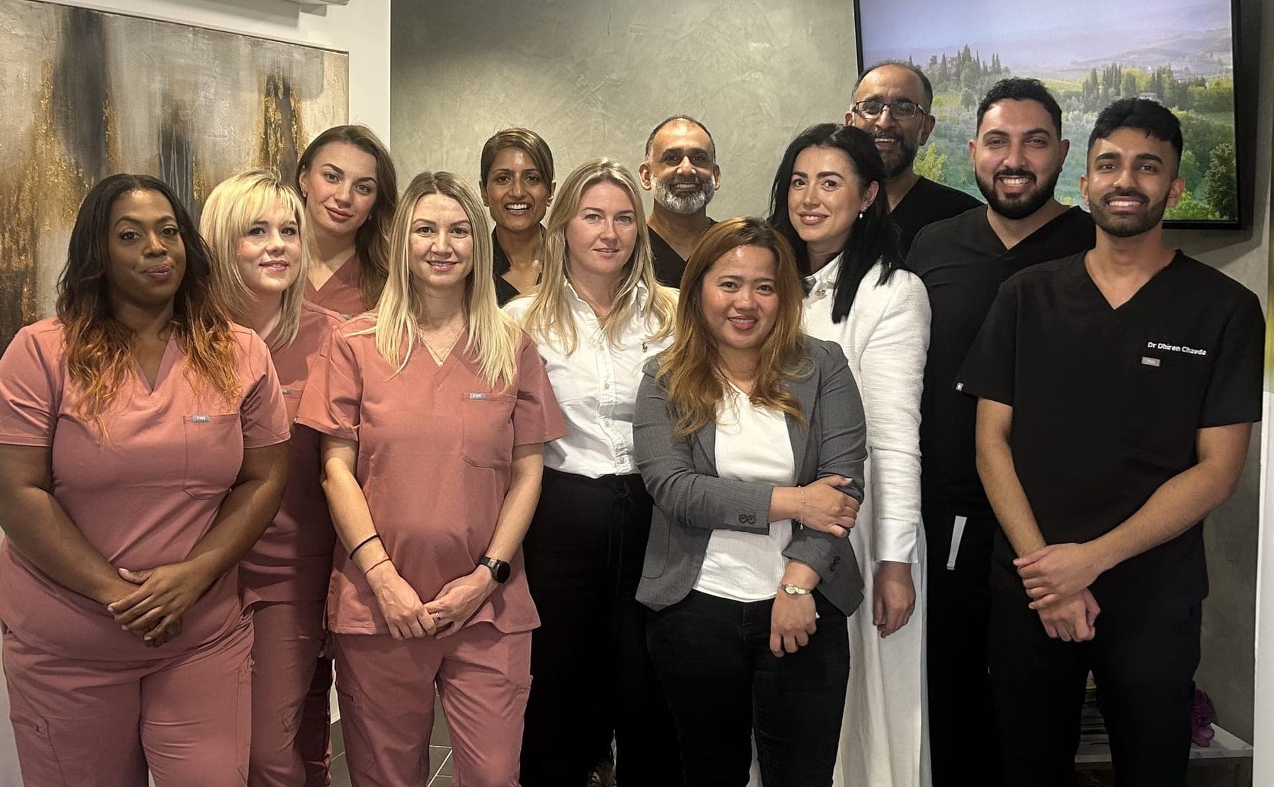 The Surrey Docks Dental team standing together in the practice